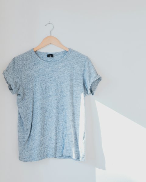 Heather gray t-shirt on a wooden hanger